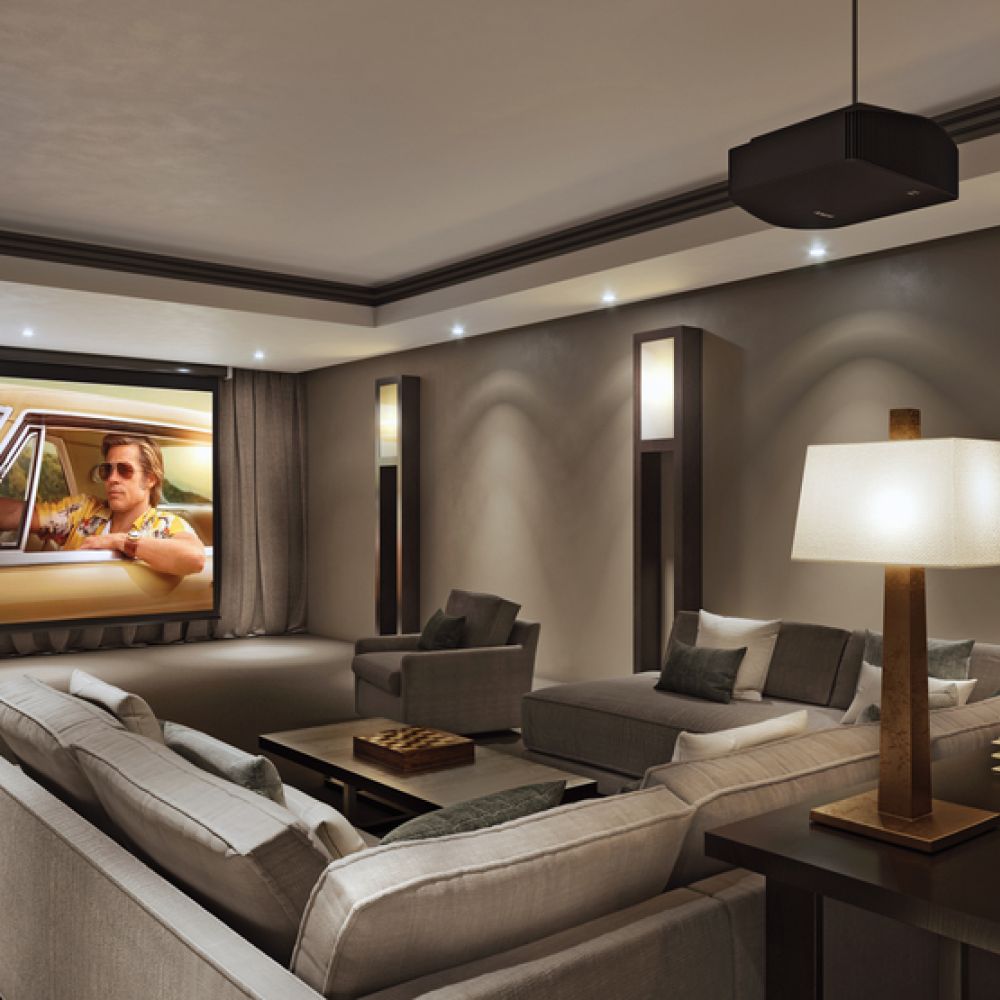 <span class="uk-h4">A luxury media room with a large screen, hidden audio, and expansive sofa seating.</span>